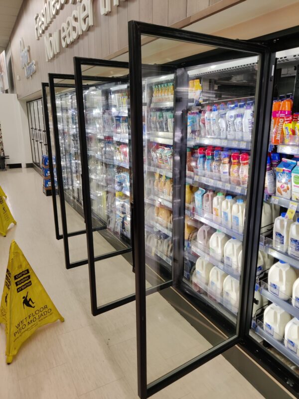 Open refrigerator doors fitted with Clarifoil anti-fog film
